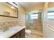 Updated bathroom with a walk-in shower and modern vanity at 5111 Coral Blvd, Bradenton, FL 34210