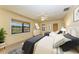 Bright bedroom features two beds, natural light from window, and a ceiling fan at 5111 Coral Blvd, Bradenton, FL 34210