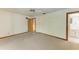 Spacious carpeted bedroom with a ceiling fan and ensuite bathroom access at 5111 Coral Blvd, Bradenton, FL 34210