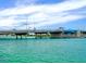 View of a bridge with calm, clear water below a bright, sunny sky in a vibrant waterfront community at 5111 Coral Blvd, Bradenton, FL 34210