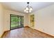 Dining room with wood floors, chandelier and patio door at 5111 Coral Blvd, Bradenton, FL 34210
