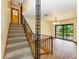 Foyer with stairway, iron railing and view into an open dining room at 5111 Coral Blvd, Bradenton, FL 34210