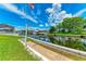 Scenic waterfront home with lush green lawn, calm canal, and inviting atmosphere at 5111 Coral Blvd, Bradenton, FL 34210