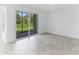 Spacious dining area with tile floors and sliding glass doors to the patio at 17445 Opal Sand Dr # 104, Venice, FL 34293