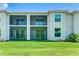 Two-story building with a screened-in patio at 17445 Opal Sand Dr # 104, Venice, FL 34293