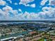 Wide aerial showcasing the neighborhood and coastline at 12405 3Rd E St # 206, Treasure Island, FL 33706