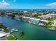 Aerial view of waterfront condo community, showcasing boats and water access at 12405 3Rd E St # 206, Treasure Island, FL 33706
