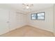 Bright bedroom with ceiling fan and ample closet space at 12405 3Rd E St # 206, Treasure Island, FL 33706