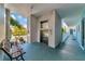 Building hallway with elevator access and bench at 12405 3Rd E St # 206, Treasure Island, FL 33706