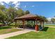 Wooden gazebo with picnic tables in a park-like setting at 12405 3Rd E St # 206, Treasure Island, FL 33706