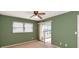 Bedroom with sliding door to balcony and ceiling fan at 12405 3Rd E St # 206, Treasure Island, FL 33706