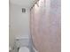 Bathroom with shower/tub combo and pink shower curtain at 12405 3Rd E St # 206, Treasure Island, FL 33706