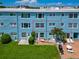 Building exterior, featuring multiple units and patio area at 12405 3Rd E St # 206, Treasure Island, FL 33706
