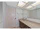 Bathroom with vanity, mirror, and tiled walls at 12405 3Rd E St # 206, Treasure Island, FL 33706