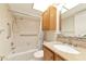 Clean bathroom, granite vanity, and tub with grab bars at 12405 3Rd E St # 206, Treasure Island, FL 33706