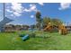 Modern playground with various play structures and turf at 12405 3Rd E St # 206, Treasure Island, FL 33706