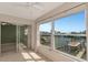 Bedroom with water views and sliding glass doors at 12405 3Rd E St # 206, Treasure Island, FL 33706