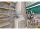 Stackable washer and dryer with shelving at 12405 3Rd E St # 206, Treasure Island, FL 33706