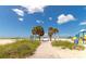 Path to beach with lush landscaping and playground visible at 12405 3Rd E St # 206, Treasure Island, FL 33706