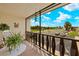 Relaxing screened balcony overlooking a parking lot and green space at 66 Boundary Blvd # 273, Rotonda West, FL 33947