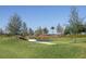 Outdoor fitness station nestled in a grassy area with trees at 10145 Spruce River Way, Parrish, FL 34219
