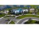 Resort-style community pool and clubhouse with lush landscaping at 10145 Spruce River Way, Parrish, FL 34219