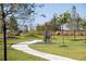 Outdoor fitness area with exercise equipment and walking path at 10145 Spruce River Way, Parrish, FL 34219