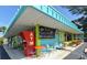 Brightly colored beach bar with outdoor seating and an ATM at 5319 Bimini Dr, Bradenton, FL 34210