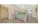 Bright bedroom with a queen bed and access to a private bathroom and pool view at 5319 Bimini Dr, Bradenton, FL 34210