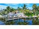 Waterfront backyard oasis featuring a private pool and dock at 5319 Bimini Dr, Bradenton, FL 34210