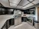 Modern kitchen with stainless steel appliances and dark cabinetry at 1499 17Th W St, Palmetto, FL 34221