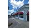 Two-story commercial building for sale with awnings at 1499 17Th W St, Palmetto, FL 34221