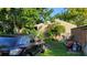 Side yard with car and storage items at 12004 Big Bend Rd, Riverview, FL 33579