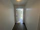 Bright entryway featuring new paint, wood-look flooring and a welcoming open door at 2049 5Th St, Sarasota, FL 34237