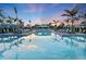 Resort-style pool with multiple lounge chairs and shaded seating areas at 6227 Dry Tortugas Dr, Sarasota, FL 34241