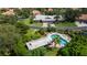 Community pool and surrounding villas aerial view at 3851 Wilshire Dr # 9, Sarasota, FL 34238