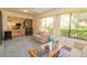 Bright sunroom offering ample seating and views of the backyard at 3851 Wilshire Dr # 9, Sarasota, FL 34238