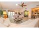Spacious living room with ample seating and large windows at 3851 Wilshire Dr # 9, Sarasota, FL 34238