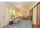 Relaxing sunroom with comfy seating and plenty of natural light at 3851 Wilshire Dr # 9, Sarasota, FL 34238