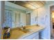 Bathroom with single sink and storage at 3851 Wilshire Dr # 9, Sarasota, FL 34238