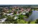 Wide aerial view of community with lake and villas at 3851 Wilshire Dr # 9, Sarasota, FL 34238