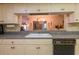 Well-equipped kitchen with granite countertops and dishwasher at 3851 Wilshire Dr # 9, Sarasota, FL 34238