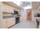 Efficient kitchen with ample cabinetry and tile flooring at 3851 Wilshire Dr # 9, Sarasota, FL 34238