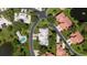 Aerial view showing home, neighborhood, and nearby lake at 3851 Wilshire Dr # 9, Sarasota, FL 34238