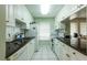Clean and efficient kitchen with white cabinets at 3851 Wilshire Dr # 9, Sarasota, FL 34238