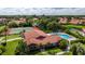 Aerial view of community pool, tennis courts, and clubhouse at 3851 Wilshire Dr # 9, Sarasota, FL 34238