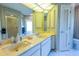 Double vanity bathroom with a shower and linen closet at 3851 Wilshire Dr # 9, Sarasota, FL 34238
