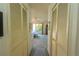 Hallway connecting to bedrooms with built-in storage at 3851 Wilshire Dr # 9, Sarasota, FL 34238