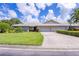 Two-car garage and well-maintained landscaping at 3851 Wilshire Dr # 9, Sarasota, FL 34238