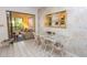Charming dining area with glass table and four chairs at 3851 Wilshire Dr # 9, Sarasota, FL 34238